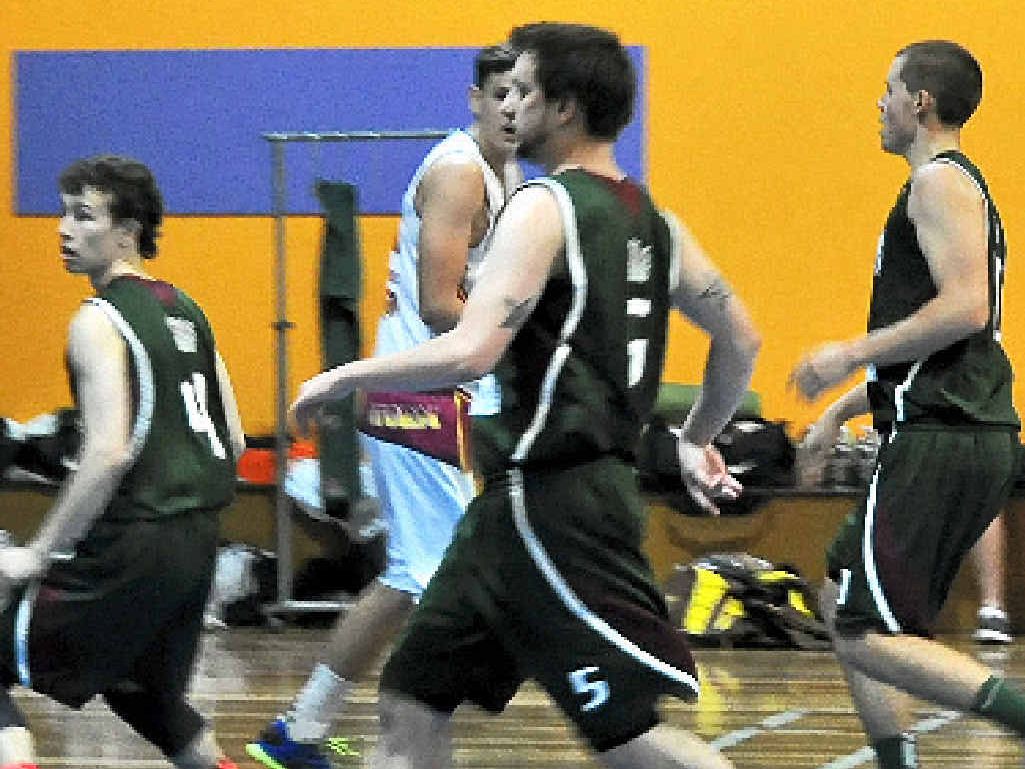 BACKING UP: Warwick Wildcats players race into the defence in the dying moments of the first quarter of their game against West Logan. BACKING UP: Warwick Wildcats players race into the defence in the dying moments of the first quarter of their game against West Logan.